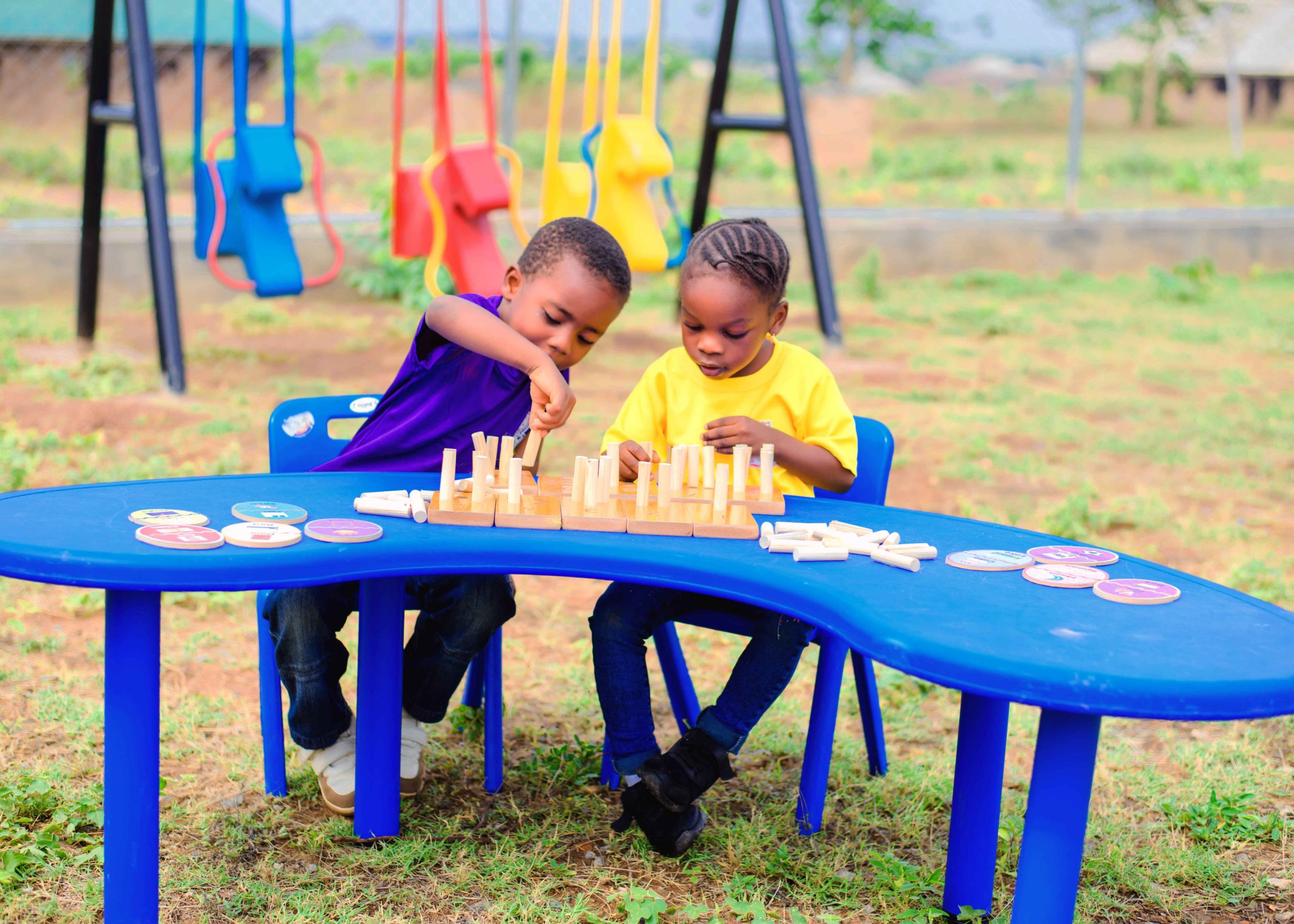 Young pupils concentrating during a chess match at Noble Brains Academy
