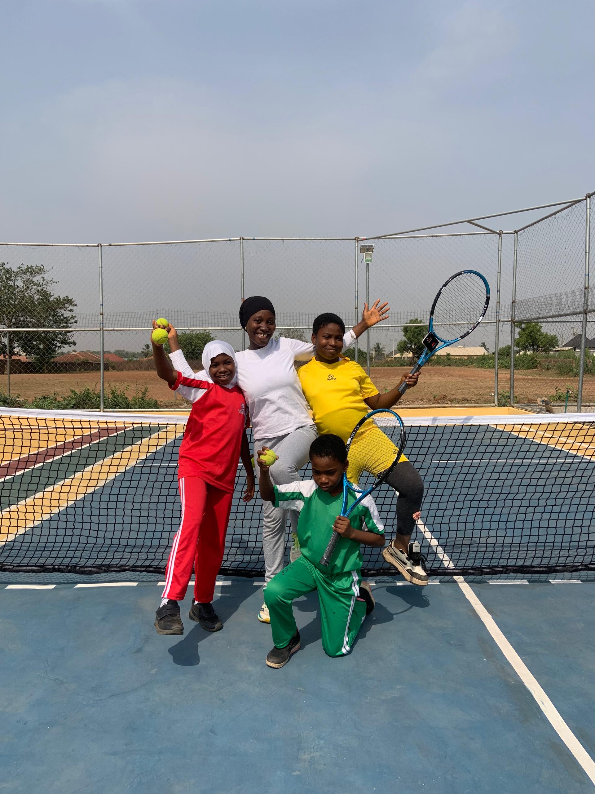PE instructor and students on sports arena